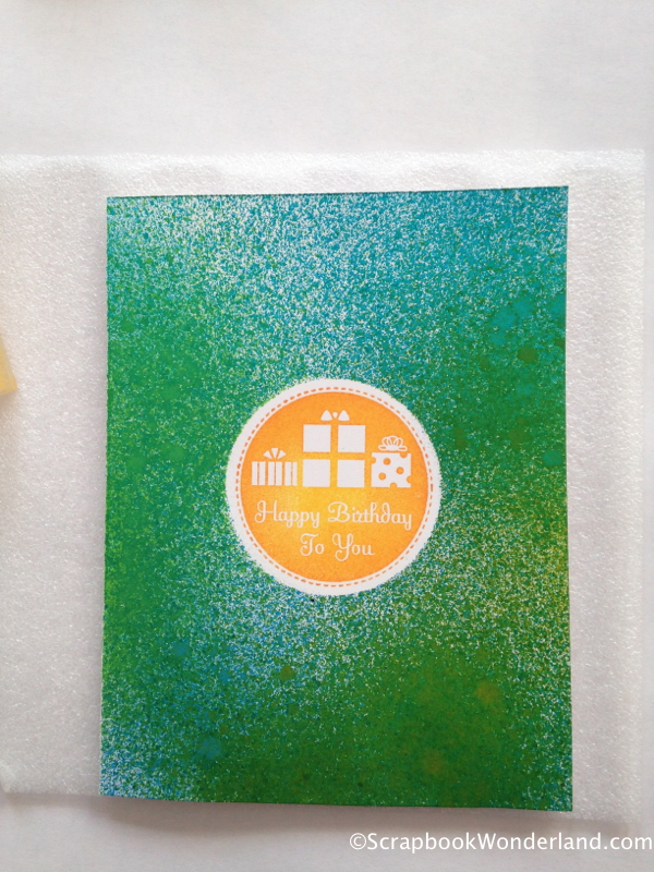 Use spray inks to create a quick birthday card.